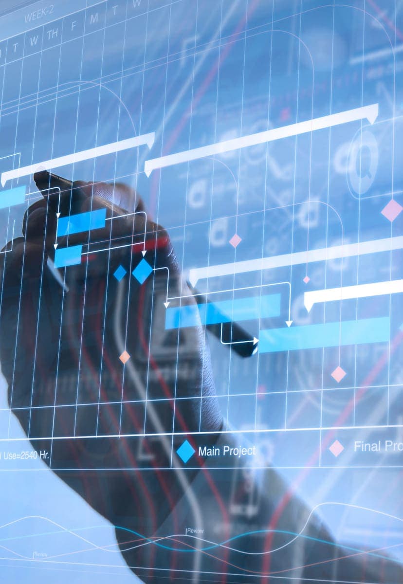 A person drawing on data on a translucent computer screen