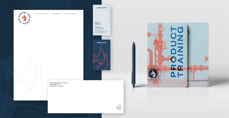 Paper, business cards, a notepad, pen, and an envelope branded for Hose Monster.