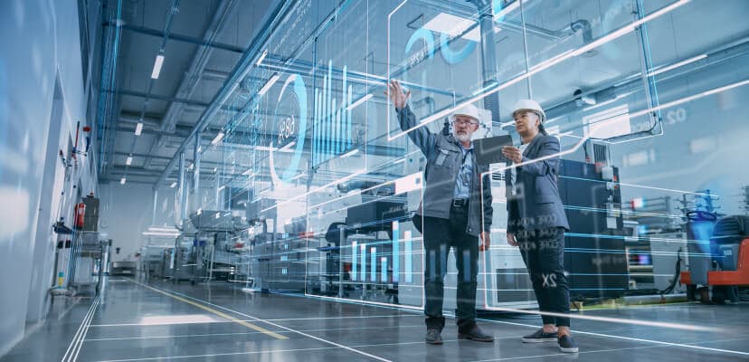 two manufacturer leaders working on a high tech floor
