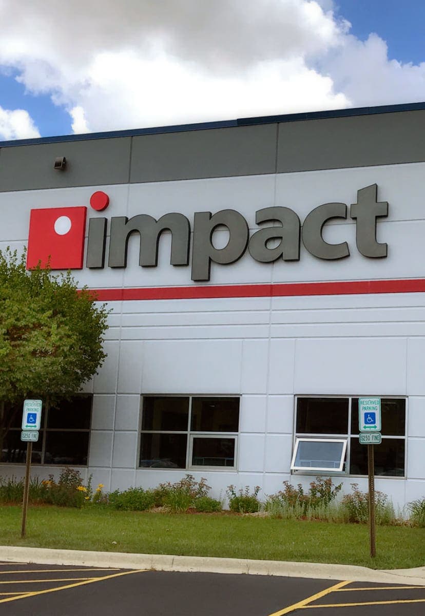 Impact Networking sign on side of building