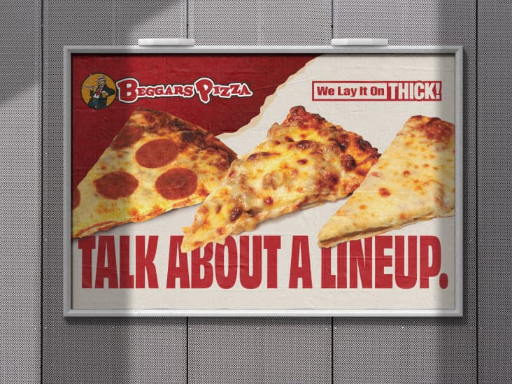 A billboard at Guaranteed Rate Field featuring slices of pepperoni, sausage, and cheese pizza and a headline reading “Talk About a Lineup.”